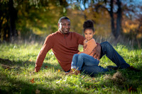 Family portrait session captured by Studio Lana in Albany, NY during peak fall foliage. Warm autumn tones and candid family connections in natural light.